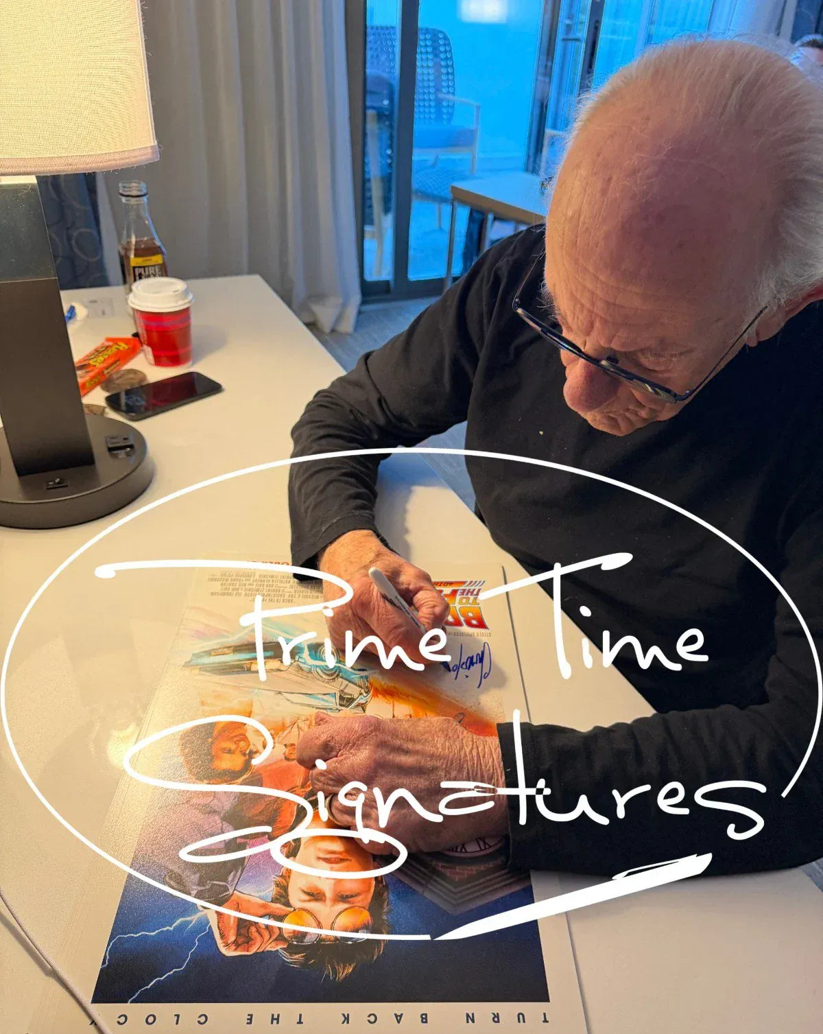 Christopher Lloyd signing autograph in person — Prime Time Signatures