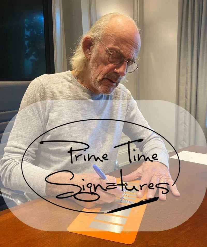 Christopher Lloyd signing autograph in person — Prime Time Signatures