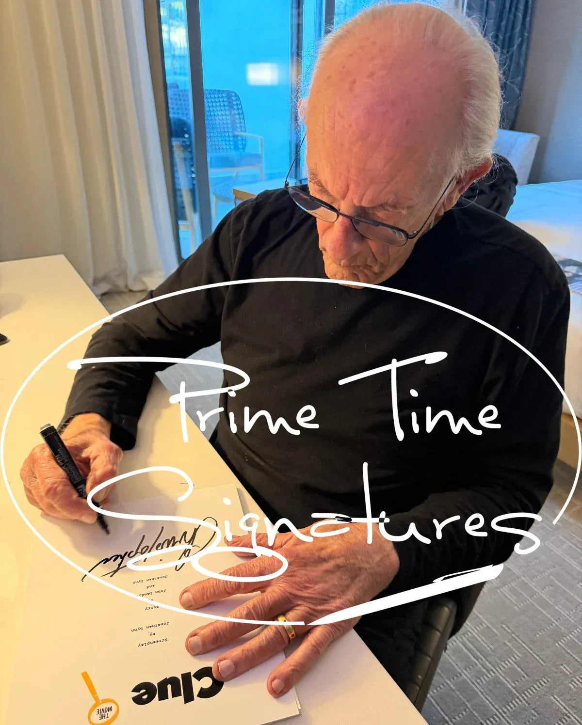 Christopher Lloyd signing autograph in person — Prime Time Signatures