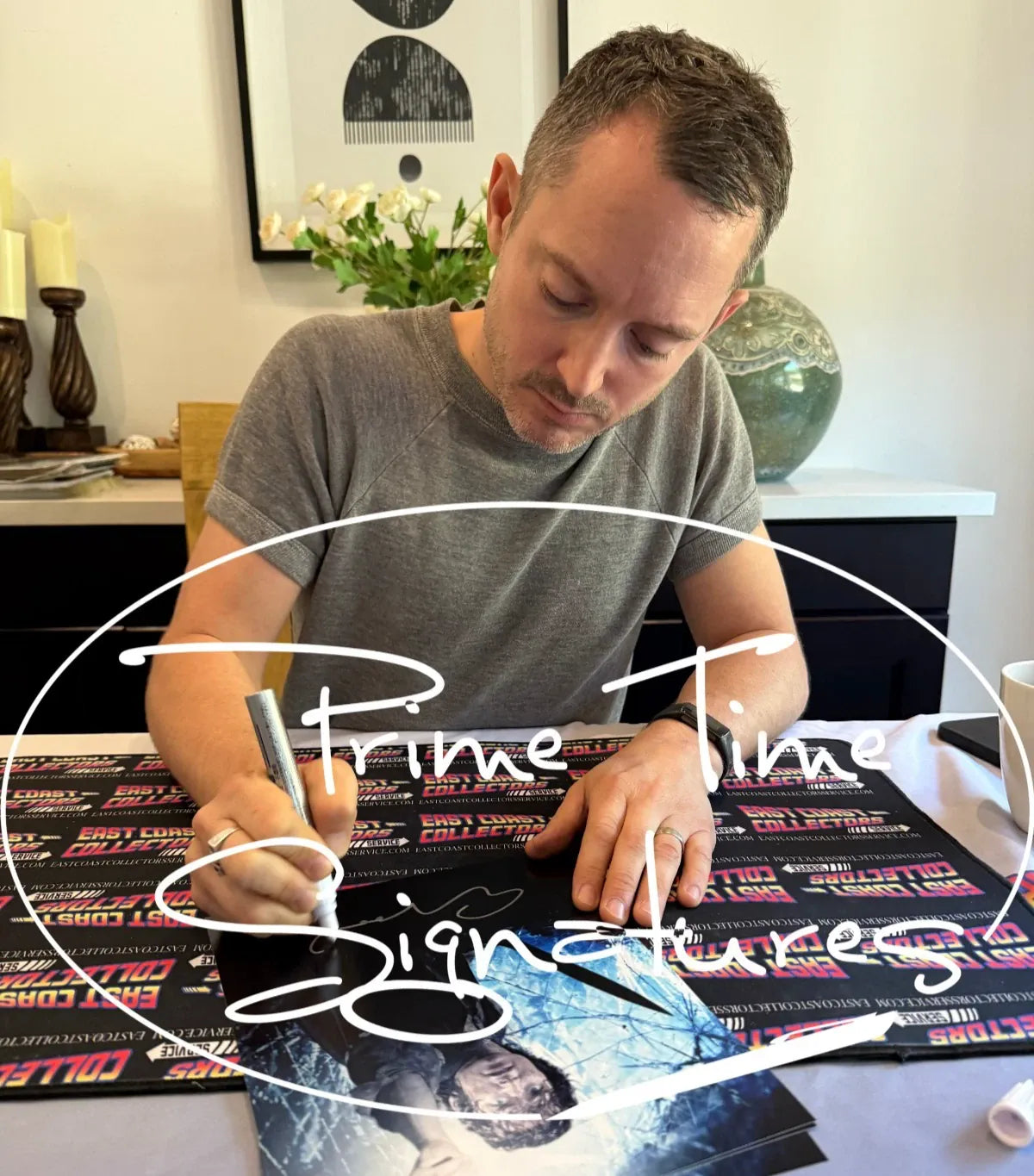 Elijah Wood signing autograph in person