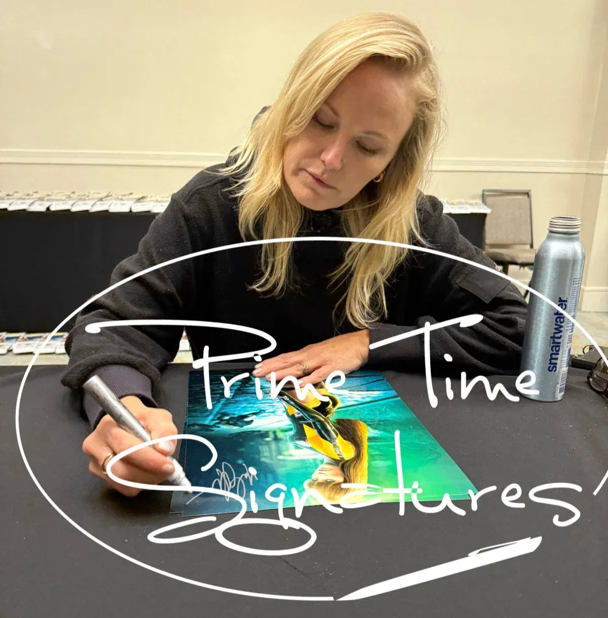 Malin Akerman signing autograph in person — Prime Time Signatures