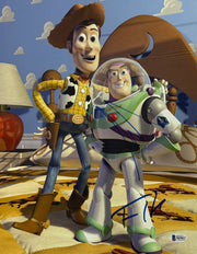 Buzz Lightyear and Woody 11x14 Toy Story photo signed by Tim Allen and Tom Hanks — dual-signed — Beckett hologram authenticated
